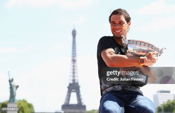 Rafael Nadal of Spain poses during a photocall to celebrate his record breaking 10th French Open title at Quai de Grenelle on June 12, 2017 in Paris,...