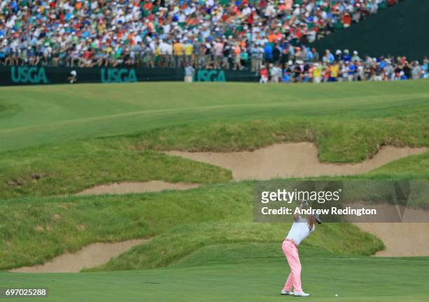 Justin Thomas of the United States plays his shot on the 18th hole during the third round of the 2017 U.S. Open at Erin Hills on June 17, 2017 in...