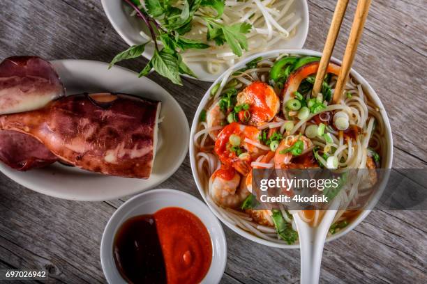 pho, vietnamese soup bowl, with seafood - vietnamese mint stock pictures, royalty-free photos & images