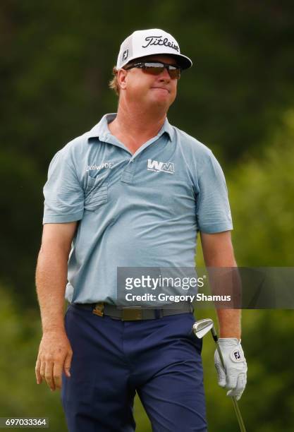 Charley Hoffman of the United States reacts after his shot on the 16th hole during the third round of the 2017 U.S. Open at Erin Hills on June 17,...