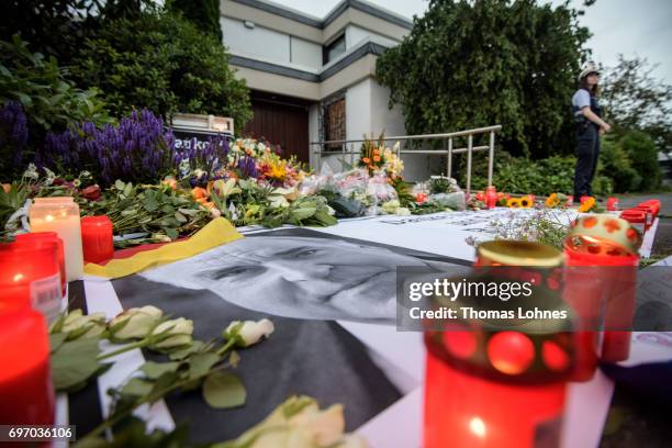 Flowers and Candles lay next to a portrait of Helmut Kohl in front of the home of former German Chancellor Helmut Kohl in Oggersheim district on June...