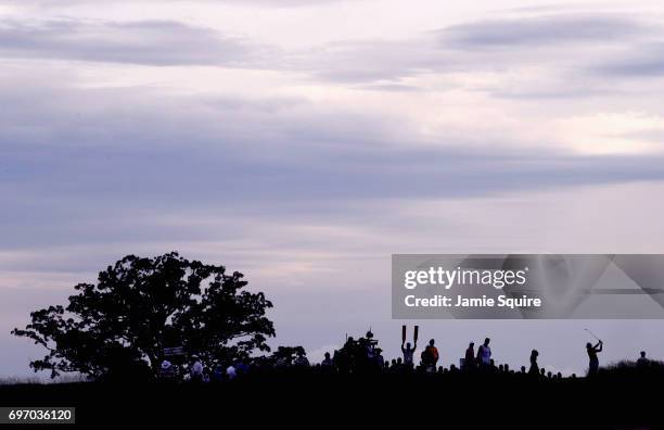 Tommy Fleetwood of England plays his shot from the 13th tee during the third round of the 2017 U.S. Open at Erin Hills on June 17, 2017 in Hartford,...