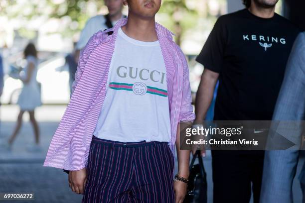Guest wearing a Gucci tshirt is seen outside Neil Barrett during Milan Men's Fashion Week Spring/Summer 2018 on June 17, 2017 in Milan, Italy.
