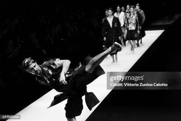 Models walk the runway at the Emporio Armani fashion show during Milan Men's Fashion Week Spring/Summer 2018on June 17, 2017 in Milan, Italy.