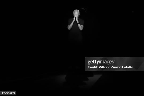 Designer Giorgio Armani acknowledges the applause of the public after the Emporio Armani fashion show during Milan Men's Fashion Week Spring/Summer...