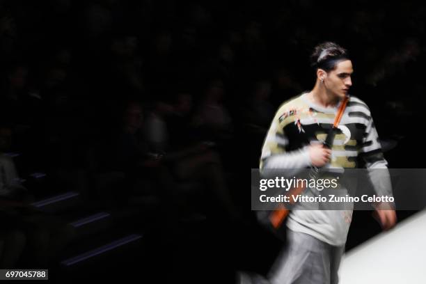 Model walks the runway at the Emporio Armani fashion show during Milan Men's Fashion Week Spring/Summer 2018on June 17, 2017 in Milan, Italy.