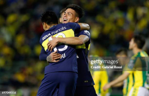 Jonathan Silva of Boca Juniors celebrates with teammate Ricardo Centurión after scoring the fourth goal of his team during a match between Aldosivi...