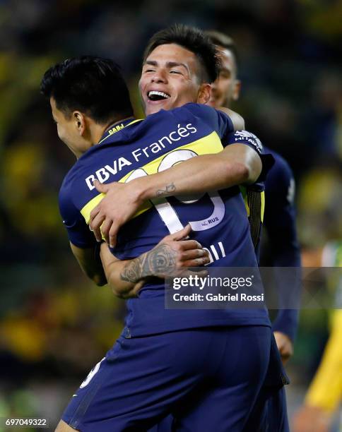 Jonathan Silva of Boca Juniors celebrates with teammate Ricardo Centurión after scoring the fourth goal of his team during a match between Aldosivi...