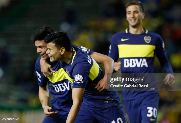 Jonathan Silva of Boca Juniors celebrates with teammate Ricardo Centurión after scoring the fourth goal of his team during a match between Aldosivi...