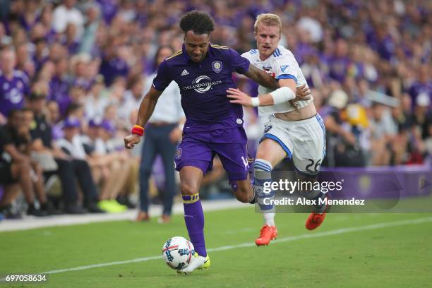 Giles Barnes of Orlando City SC and Kyle Fisher of Montreal Impact fight for the ball during a MLS soccer match between the Montreal Impact and the...