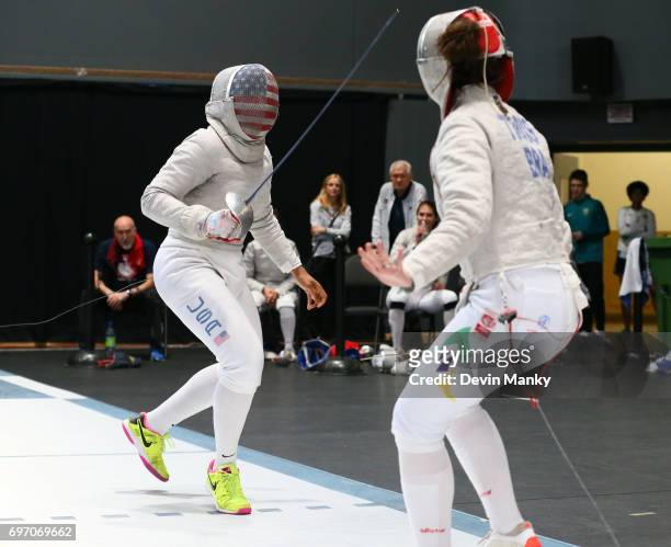 Ibtihaj Muhammad of the USA fences Karina Trois of team Brazil during the Team Women's Sabre event on June 17, 2017 at the Pan-American Fencing...