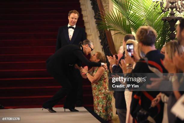 Maryse Gaspard embraces Trudy Coxe on the runway at the Pierre Cardin: 70 Years of Innovation fashion show at The Breakers on June 17, 2017 in...