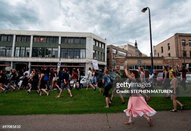 Protesters march through Loring Park on July 17, 2017 in Minneapolis, Minnesota. Demonstrations have taken place each day since a jury acquitted...