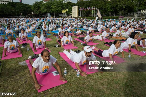 Thousand of Yoga practitioners commemorate the 3rd 'International Yoga Day' held by the Indian Embassy at the Chulalongkorn University in Central...