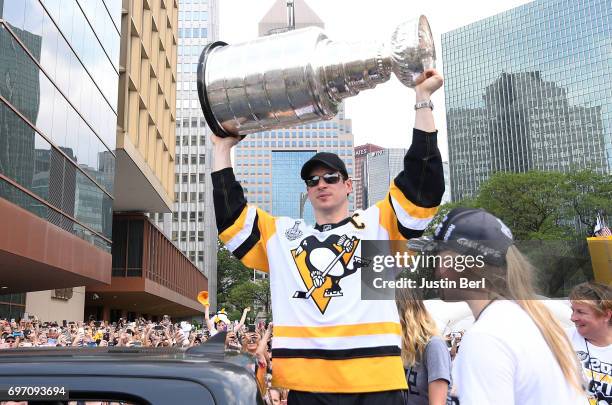 Sidney Crosby of the Pittsburgh Penguins hoists the Stanley Cup during the Victory Parade and Rally on June 14, 2017 in Pittsburgh, Pennsylvania.