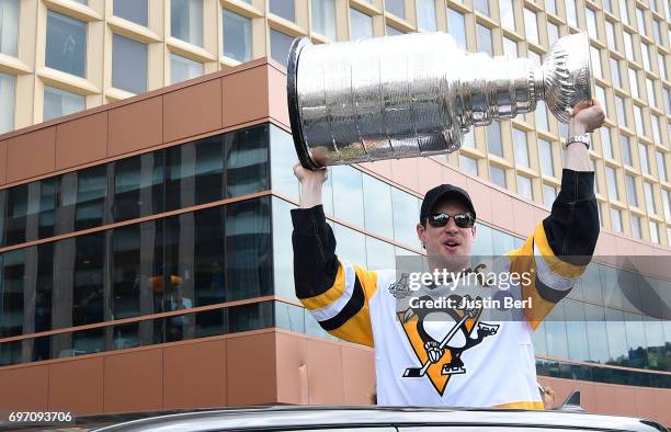 Sidney Crosby of the Pittsburgh Penguins hoists the Stanley Cup during the Victory Parade and Rally on June 14, 2017 in Pittsburgh, Pennsylvania.