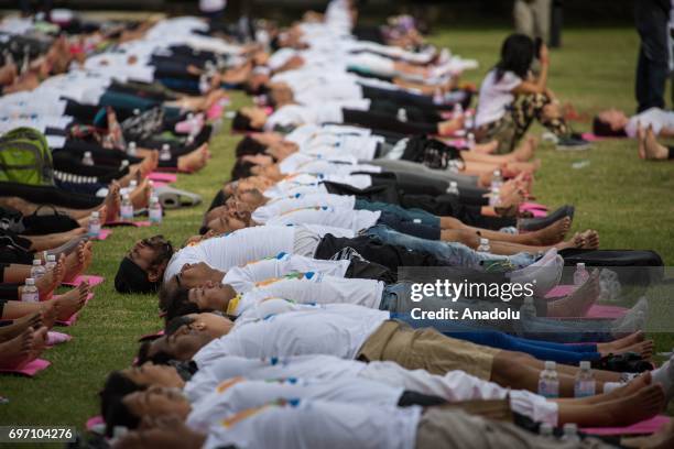 Thousand of Yoga practitioners commemorate the 3rd 'International Yoga Day' held by the Indian Embassy at the Chulalongkorn University in Central...