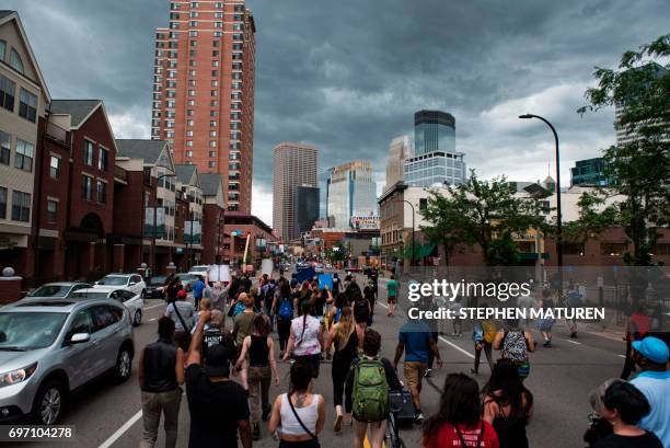 Protesters march on July 17, 2017 in Minneapolis, Minnesota. Demonstrations have taken place each day since a jury acquitted police officer Jeronimo...