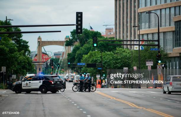 Police officers redirect traffic during a protest on July 17, 2017 in Minneapolis, Minnesota. Demonstrations have taken place each day since a jury...