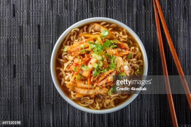 kimchee ramen - bowl of soup stockfoto's en -beelden