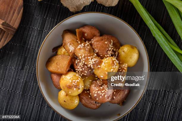 ginger soy sauce simmered gold potatoes - yukon gold stock pictures, royalty-free photos & images