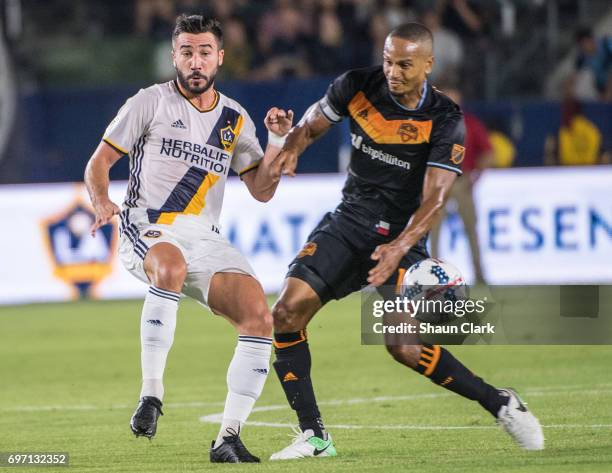 Romain Alessandrini of Los Angeles Galaxy and Ricardo Clark of Houston Dynamo during the Los Angeles Galaxy's MLS match against Houston Dynamo at the...