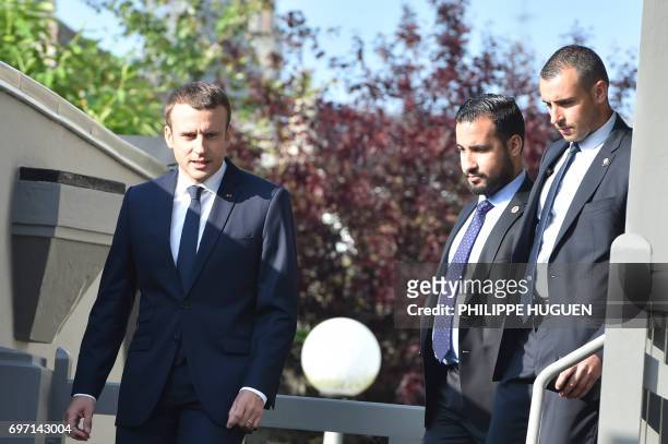 French President Emmanuel Macron leaves his house to vote in Le Touquet, northern France, during the second round of the French parliamentary...