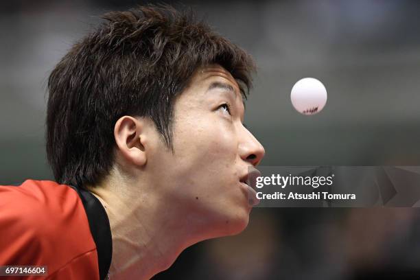 Jun Mizutani of Japan serves during the men's singles semi final match against Zhendong Fan of China on the day 5 of the 2017 ITTF World Tour...