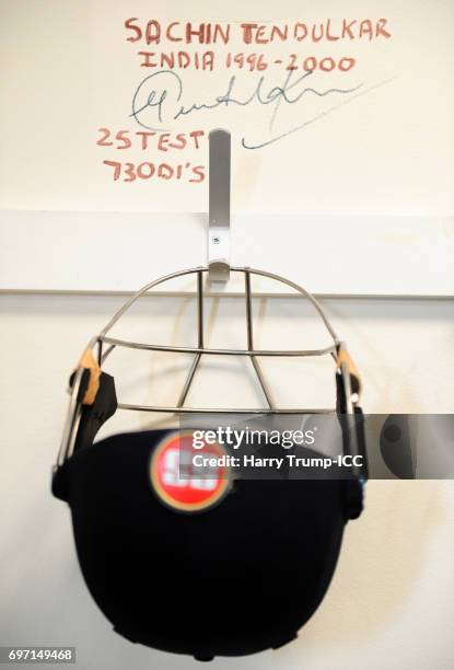 Detailed view of a helmet hanging in the changing room below the signature of Former Indian Cricketer Sachin Tendulkar during the ICC Champions...