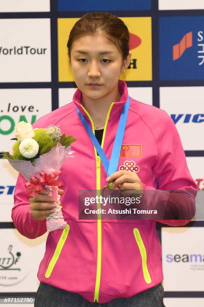 Meng Chen of China poses with the silver medal on the podium during the day 5 of the 2017 ITTF World Tour Platinum LION Japan Open at Tokyo...