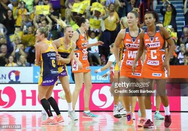 The Giants react as Laura Langman and Laura Sherian celebrate victory with their teammates at the final whistle during the Super Netball Grand Final...