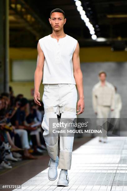Model presents a creation for fashion house Dirk Bikkembergs during the Men's Spring/Summer 2018 fashion shows in Milan, on June 18, 2017. / AFP...