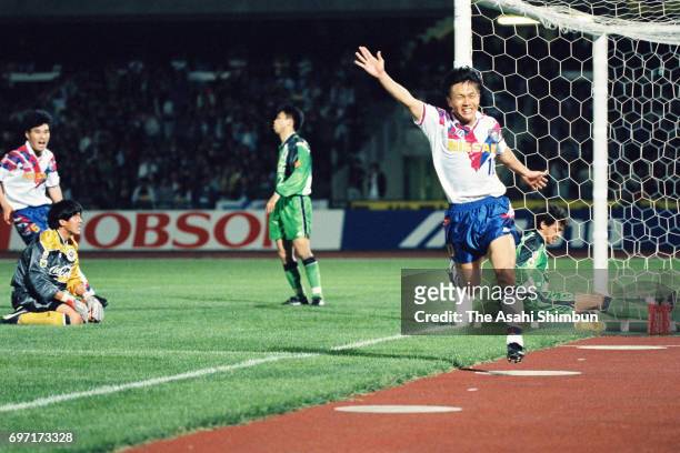Fumitake Miura of Yokohama Marinos celebrates scoring his side's third goal during the J.League match between Verdy Kawasaki and Yokohama Marinos at...