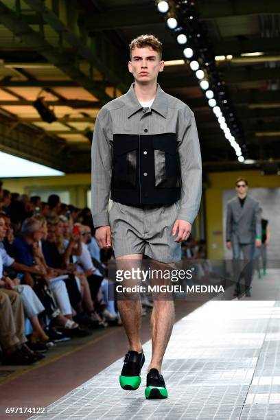 Model presents a creation for fashion house Dirk Bikkembergs during the Men's Spring/Summer 2018 fashion shows in Milan, on June 18, 2017. / AFP...