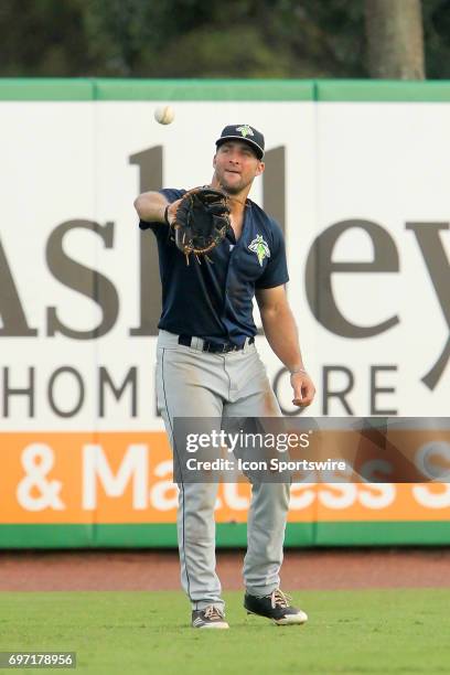 Tim Tebow of the Fireflies catches a baseball during the minor league game between the Columbia Fireflies and the Charleston RiverDogs on June 17,...