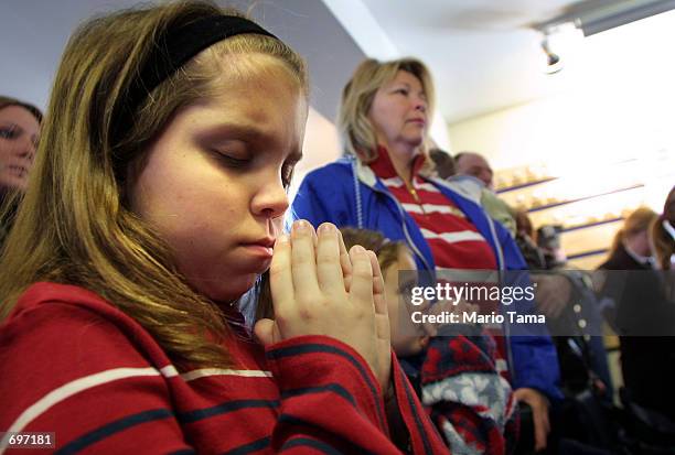 Year-old Kathleen Harmon prays during a ceremony following the christening of the new high-speed ferry, "The Moira Smith" which honors her cousin,...