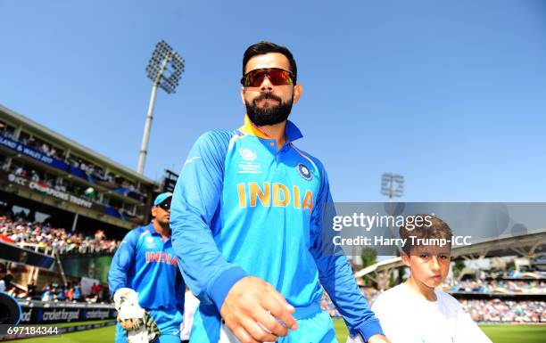 Virat Kohli, Captain of India walks out for the start during the ICC Champions Trophy Final match between India and Pakistan at The Kia Oval on June...