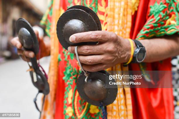 Traditional Gnawa musician using krakebs musical instrument inside Fes Medina. A scene from a daily life in Fes during the Ramadan 2017. On Saturday,...