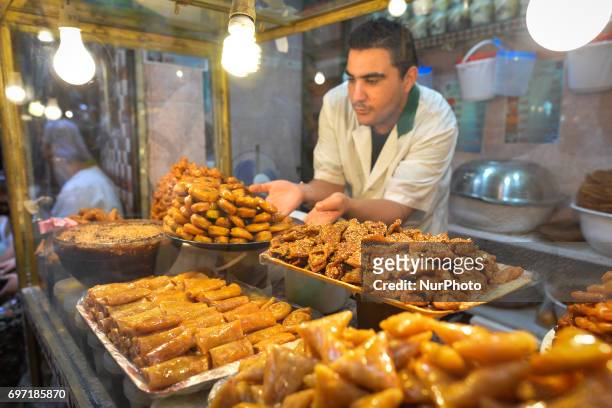 Stand with Moroccan sesame cookies and cakes with honey on display for sale inside Fes Medina. A scene from a daily life in Fes during the Ramadan...