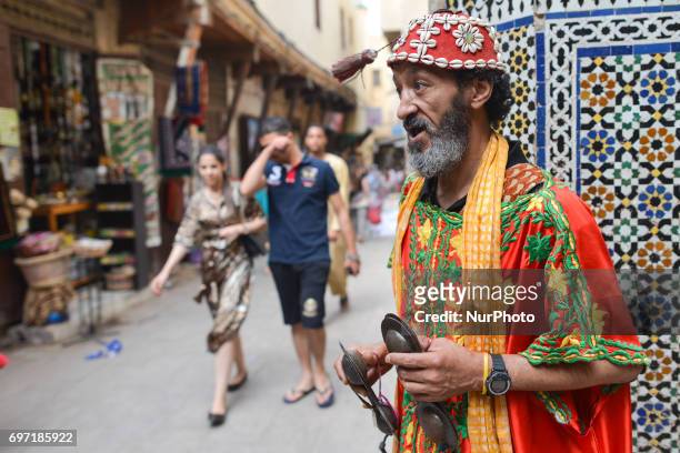 Traditional Gnawa musician sings and plays using krakebs inside Fes Medina. A scene from a daily life in Fes during the Ramadan 2017. On Saturday,...