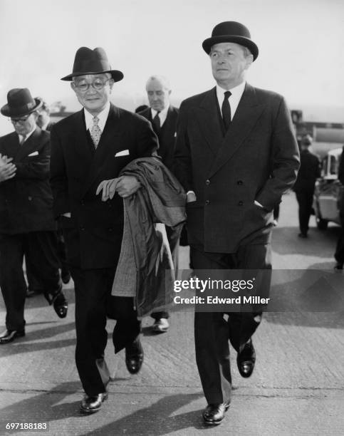 Japanese Foreign Minister Aiichiro Fujiyama is met by British Foreign Secretary Selwyn Lloyd on his arrival at at London Airport , 27th September...