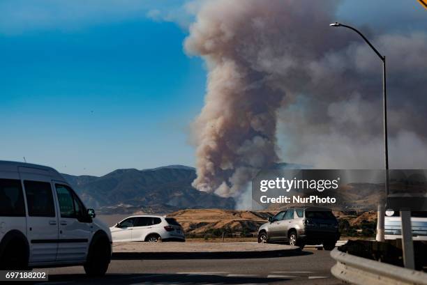 The Castaic Lake wildfire is seen from the 5 Freeway in Castaic, California on June 17, 2017. Castaic, California on June 17, 2017. Firefighters...