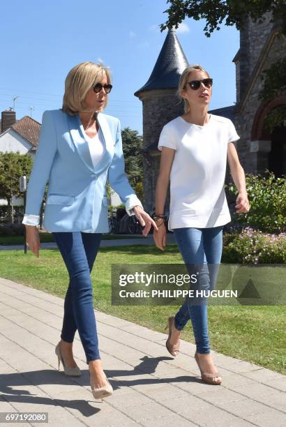 Brigitte Macron , wife of French President Emmanuel Macron, and her daughter Tiphaine Auziere arrive to vote for the second round of the French...