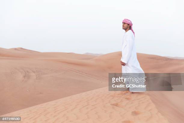 arab admiring the the dunes of arabia - bahrain tourism stock pictures, royalty-free photos & images