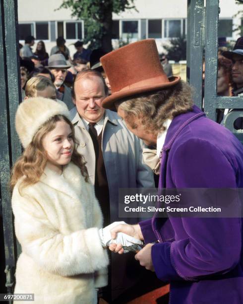 From right to left, actors Gene Wilder as Willy Wonka, Roy Kinnear as Mr. Salt and Julie Dawn Cole as Veruca Salt in the film 'Willy Wonka & the...