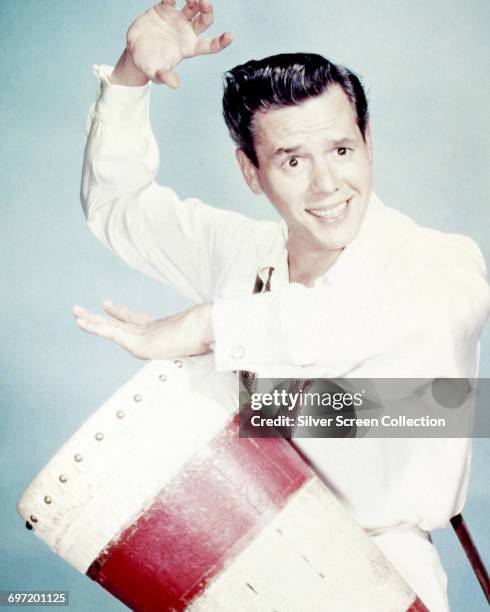 Cuban-born American actor, producer and musician Desi Arnaz on the drums, circa 1945.