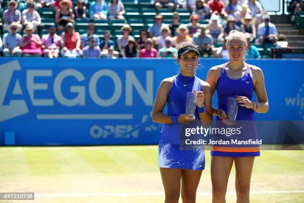 Laura Robson and Jocelyn Rae of Great Britain pose with the runners-up trophy after losing in their Women's Doubles Final match against Storm Sanders...