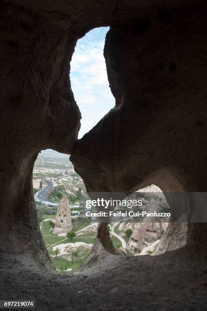 view through the window and door at uçhisar, nevşehir province, central anatolia region, turkey - butte rocky outcrop stock pictures, royalty-free photos & images