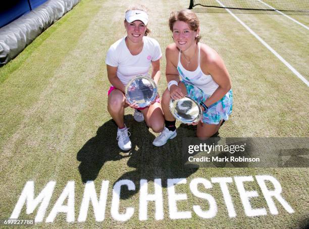 Magdalena Frech of Poland and An-Sophie Mestach of Belgium pose with their winners trophy after their women doubles final on June 18, 2017 in...