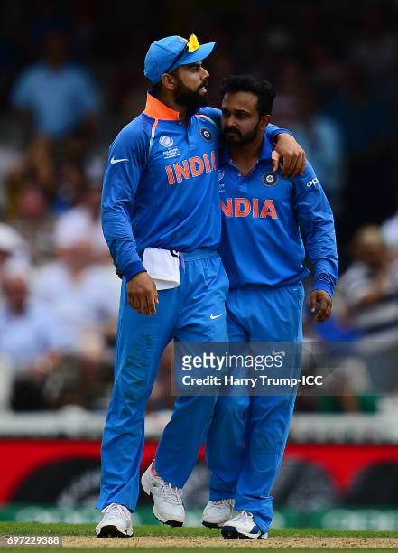 Virat Kohli and Kedar Jadhav of India celebrate the wicket of Babar Azam of Pakistan during the ICC Champions Trophy Final match between India and...